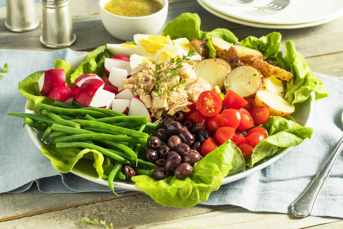 Salad Niçoise with tuna, eggs, olives and green beans
