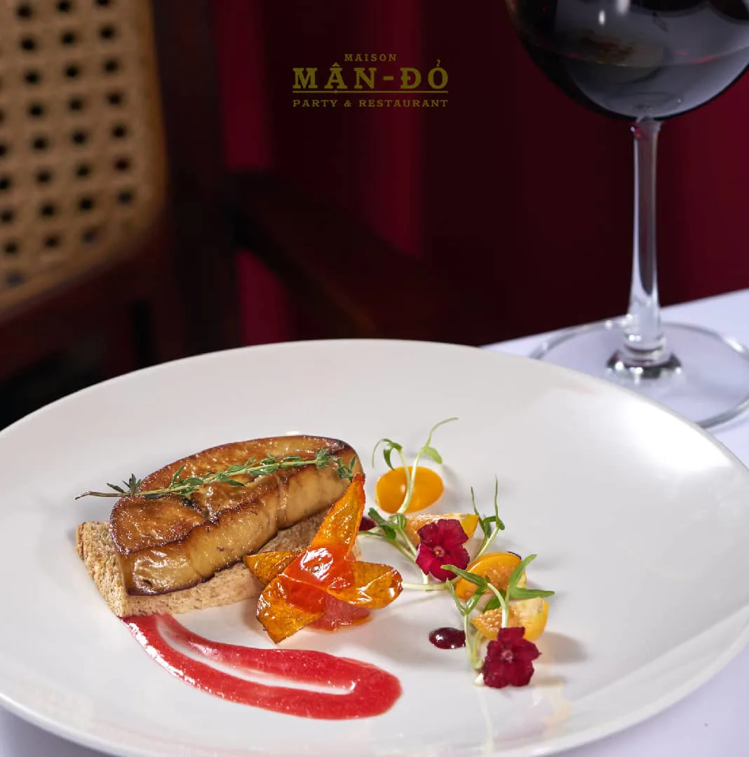 Pan-fried foie gras on a plated garnish