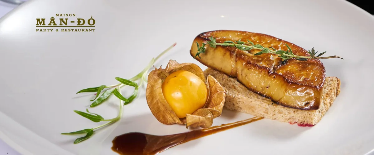 Pan-fried foie gras on a plated garnish
