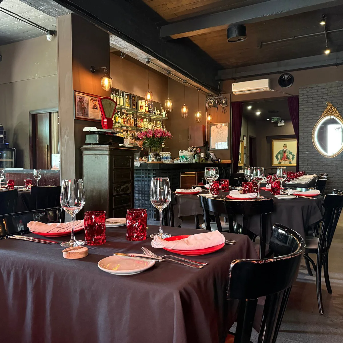 Classic elegant interior of Le Corto Restaurant with tables and artful lighting