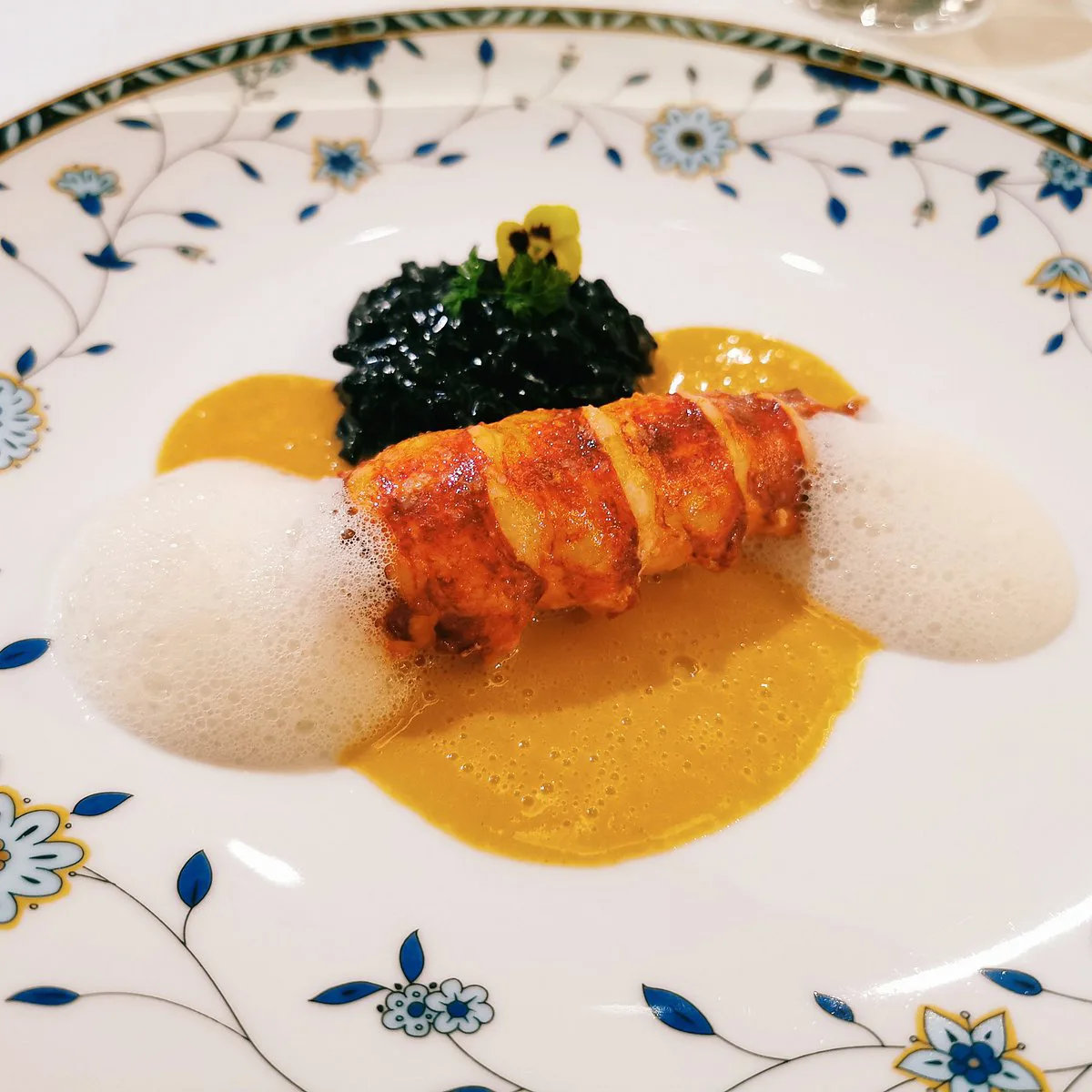 Plated lobster dish from a French restaurant