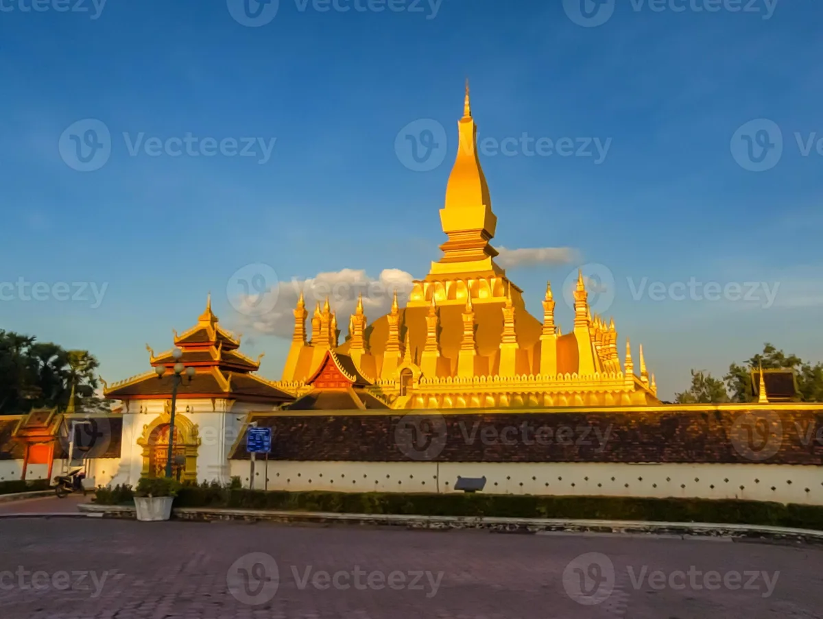Golden Pha That Luang stupa in Vientiane under blue sky