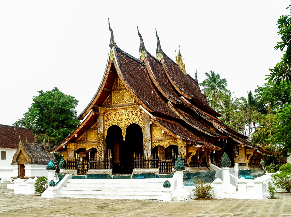 Ornate rooflines and mosaics of Wat Xieng Thong in Luang Prabang