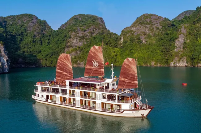 Panoramic view of Ha Long Bay with limestone karsts and cruise ship